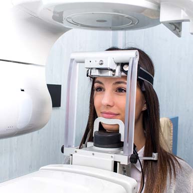 Woman using 3D CT cone beam scanner in Philadelphia for implant treatment