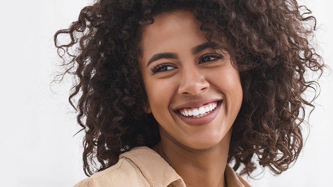 Woman with healthy smile after gum recontouring