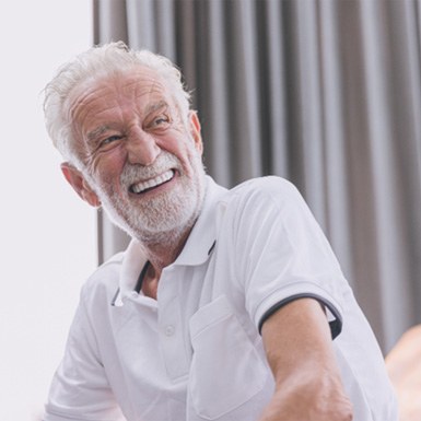 Man with dentures laughing