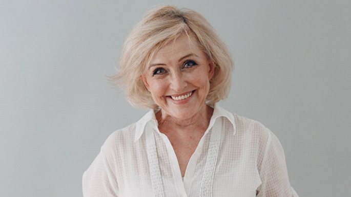 woman smiling after being a candidate for dentures in Philadelphia