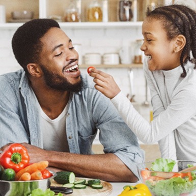 Father and daughter enjoying a healthy meal together
