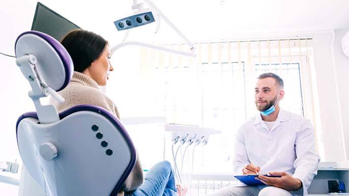 Patient learning about dental implants in Philadelphia