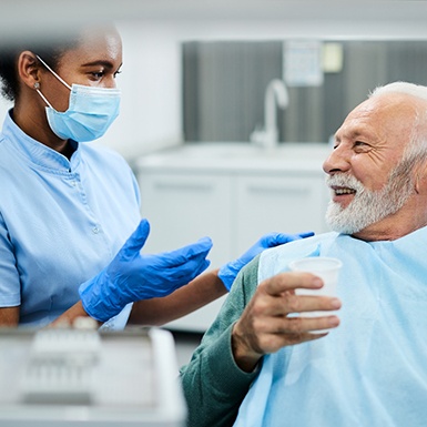 man talking to dentist 