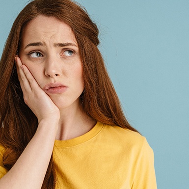 woman experiencing dental discomfort 