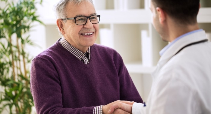 Man shaking hands with his dentist