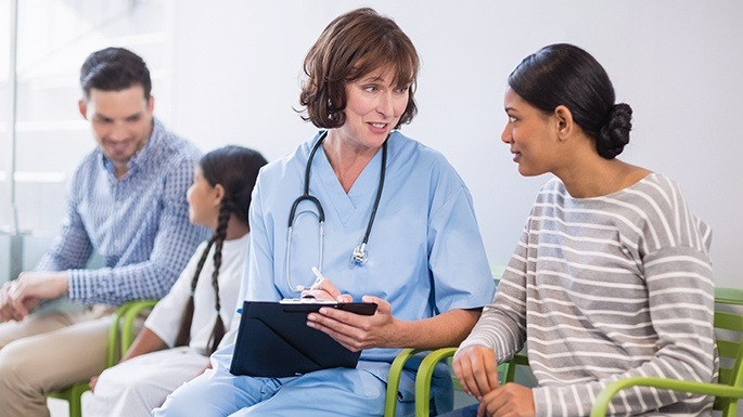 Dental team member helping patient understand how dental insurance works