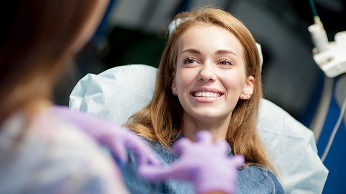 Woman smiling after oral cancer screening