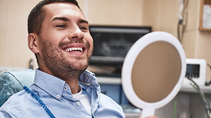 Man smiling at the dentist