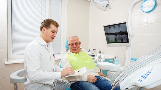 Man smiling at the dentist