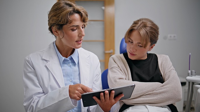Woman talking to a dentist