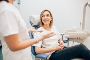 happy patient talking to dentist 